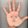 Cara_en_la_mano