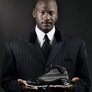 Michael_jordan_holding_sneaker