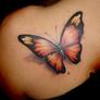 Orange_butterfly_tattoo_on_the_shoulder