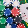 Colorful-casino-chips-green-poker-table-close-up_359031-11089