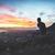 5224023-person-valley-mountain-silhouette-sit-edge-ledge-sunrise-sunset-orange-blue-sitting-man-explore-adventure-travel-building-colour-cloud-mist-free-pictures