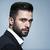 Handsome-man-black-suit-white-shirt-posing-studio-attractive-guy-fashion-hairstyle-confident-man-short-beard-125019349