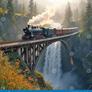 Vintage-train-crossing-over-waterfall-steam-locomotive-crosses-wooden-trestle-high-above-waterfall-surrounded-lush-370652351